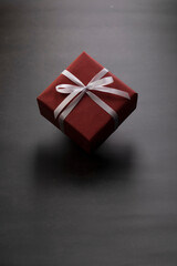 Red gift box on black background