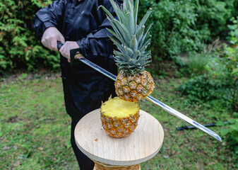 chopping fruit with a Japanese ninja sword © Nadezda