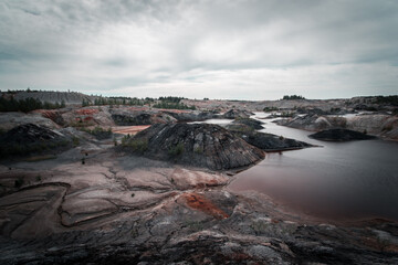 Red water in the Martian landscape in the Podzhukovo quarry in the Sverdlovsk region