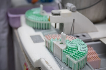 Medical scientists are preparing biopsies in the laboratory for pathologists to diagnosis ,select...