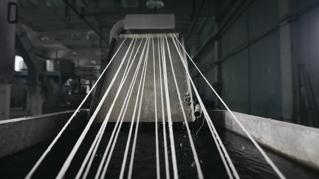 Technology for processing plastic waste into new polymers. Cooling strands in the frame.