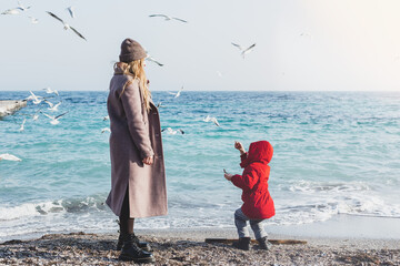 Mother and son walk to the seaside