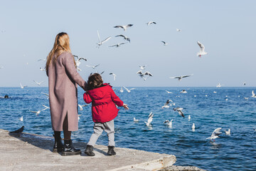 Mother and son walk to the seaside