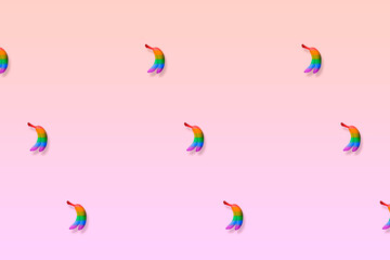 Rainbow colored bananas on a minimalistic background