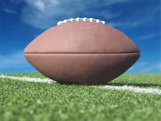 American Football ball on field with yard lines. USA games