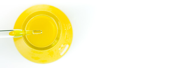 Macro yellow science experiment glass tube,Pipette with liquid biological material. Laboratory concept.