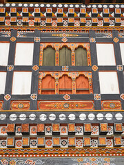 Naklejka premium Colorful window carvings in Paro Dzong, Bhutan