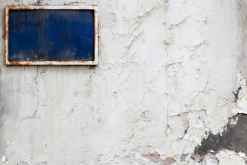 Blue blank space frame on the weathered wall