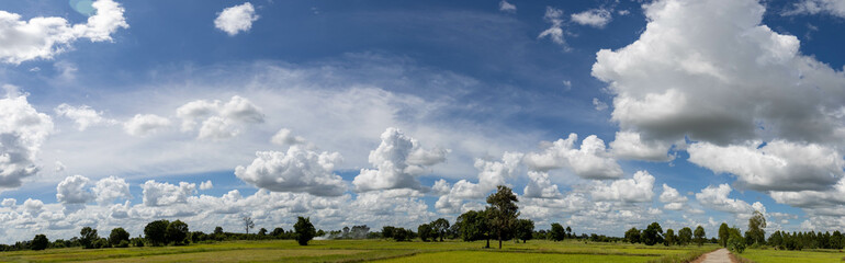 Panorama photos nature sky background daytime sky with clouds in the rainy season over the field