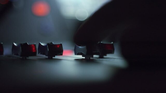 Moving some levers on a sound system -Close up