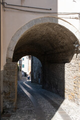 Obraz premium Cividale del Friuli (Udine), Italy - September 5, 2021: North Italy Life in the center of the lombard medieval city. Walking through narrow streets and walls. Sunny summer day. Selective focus