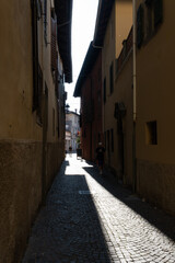 Fototapeta na wymiar Cividale del Friuli (Udine), Italy - September 5, 2021: North Italy Life in the center of the lombard medieval city. Walking through narrow streets and walls. Sunny summer day. Selective focus