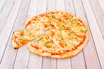 Family Italian pizza sliced chicken ratatouille with peppers and cherry tomatoes