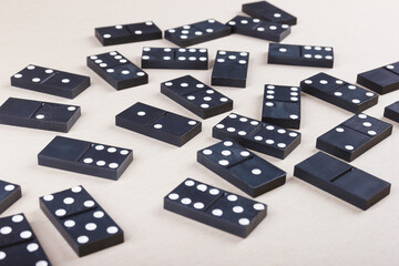 Board game dominoes on table close up.