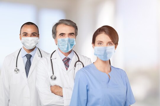 Medical Healthcare Doctor Group In Hospital Wearing Face Mask