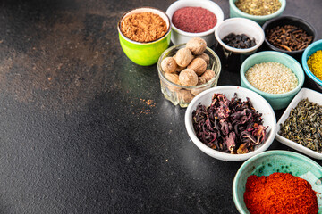 spices and herbs for cooking. Sumac, pepper, paprika, rosemary, khmelisuneli, cloves and more fresh portion ready to eat meal snack on the table copy space food background rustic. top view
