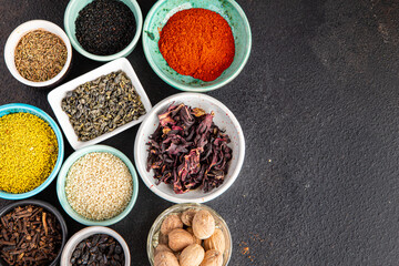 spices and herbs for cooking. Sumac, pepper, paprika, rosemary, khmelisuneli, cloves and more fresh portion ready to eat meal snack on the table copy space food background rustic. top view