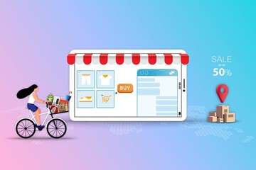 Concept of online and offline shopping, young women ride a bicycle to pick up the goods at store that already ordered from application on the tablet or mobile phone in pink and blue color background.