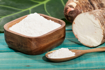 Taro Root of Colocasia esculenta and Organic Taro Flour in a bowl