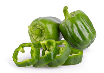 Group of fresh green bell peppers with slices isolated on a white background close up
