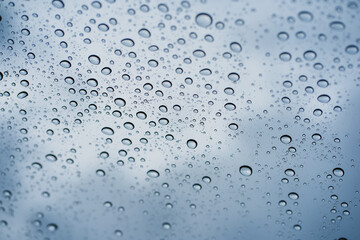 defocused background with raindrop on windshield