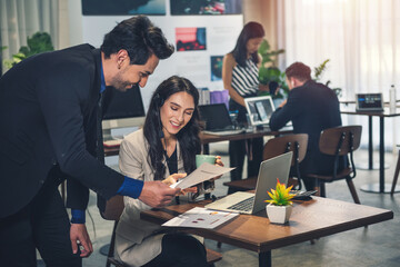 Corporate team working colleagues working in modern office.  Positive business team working at office.