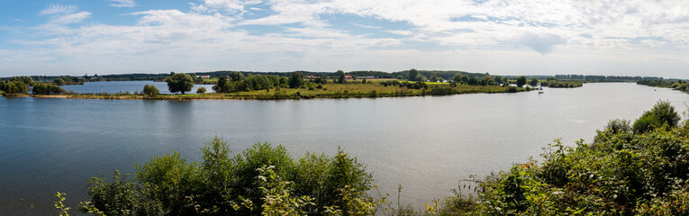 Fototapeta na wymiar Panorama view on a beautiful summer day from the river called 