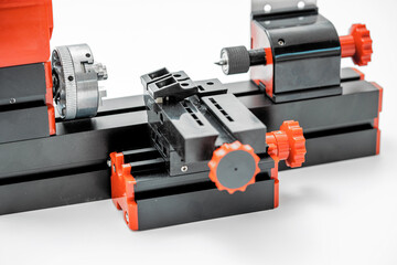 A set of parts for assembling a Small diy turning lathe machine for education and hobby.