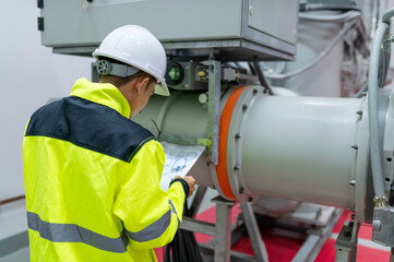 Electrical engineer man checking voltage at the Power Distribution Cabinet in the control...