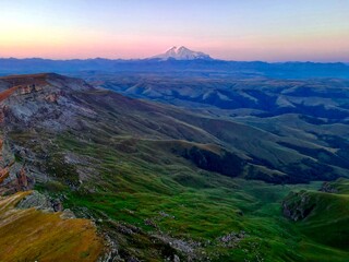 Mount Elbrus in the rays of the rising sun (Bermamyt plateau)