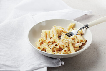 Penne pasta with cheese.