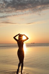 Fototapeta na wymiar silhouette of a person on a beach