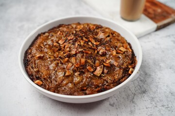 Kalthappam or Kalathappam- Malabar special Steamed sweet rice cake with shallots jaggery and dry coconut chunks