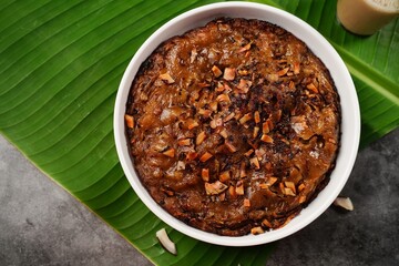 Kalthappam or Kalathappam- Malabar special Steamed sweet rice cake with shallots jaggery and dry coconut chunks