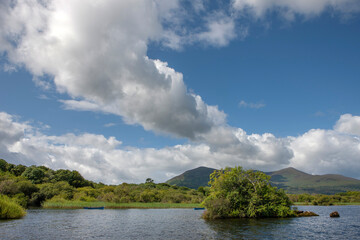 Fototapeta na wymiar Lake at Ross castle Killarney Ireland. Blue sky and clouds.