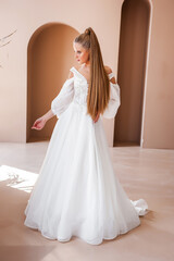 Fototapeta premium Cheerful beautiful bride in the interior