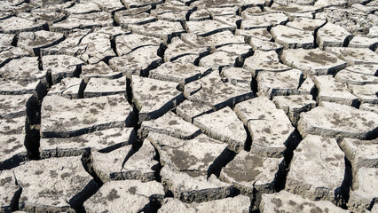 Cracked earth in a severe drought. The unbearable heat.