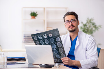 Young male doctor radiologist working in the clinic