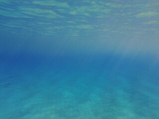 The blue abyss of the Mediterranean Sea. Sun rays under water. Blue water of the earthly sea