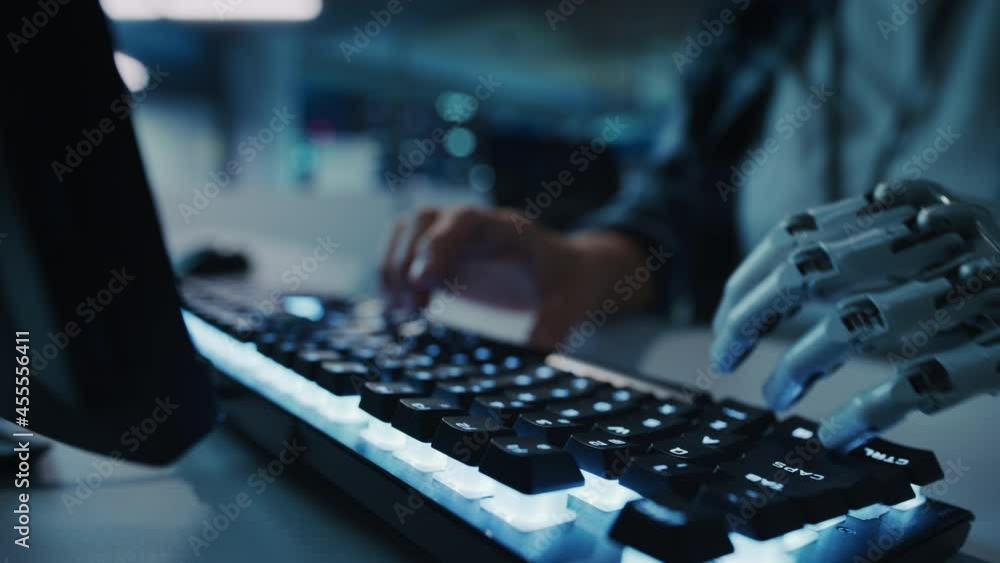 Aufkleber Close-up on Hands: Programmer With Disability Using Prosthetic Arm to Work on Computer Keyboard. Swift and Natural Use of Myoelectric Bionic Hand To Type for e-Commerce Software Project. Static Shot