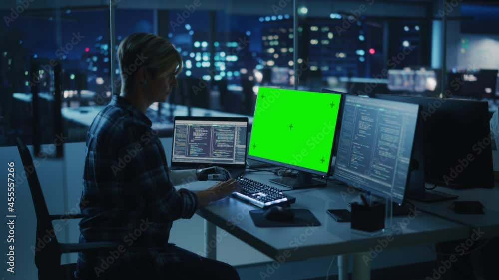 Poster Diverse Teamwork in Office at Night: Person with Disability Using Prosthetic Arm to Work on Green Screen Chroma Key Computer. Team of Software Engineers work Late to create Innovative App