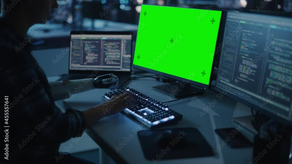Poster Night Office: Person with Disability Using Prosthetic Arm to Work on Green Screen Chroma Key Computer. Swift and Natural Use of Myoelectric Bionic Hand To Type Code for Software at Night. Medium Arc