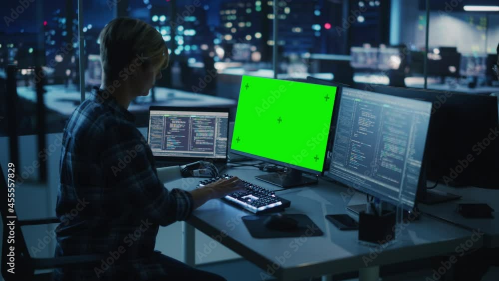 Poster Night Office: Person with Disability Using Prosthetic Arm to Work on Green Screen Chroma Key Computer. Swift and Natural Use of Myoelectric Bionic Hand To Type Code for Software at Night. Medium Arc