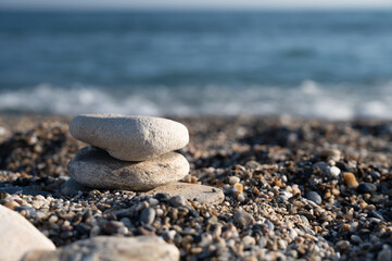 Fototapeta na wymiar Spa pebbles on the background of the sea