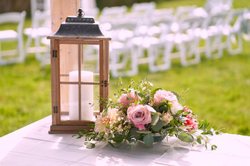 Lantern with flowers at wedding