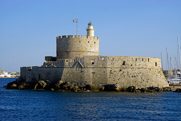 old fortress at mandraki harbor in rhodes