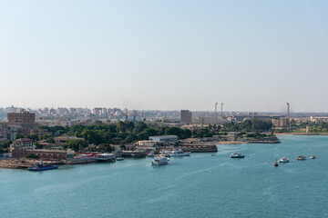 Obraz premium An Egyptian maritime port at the city of Tawfiq (Suburb of Suez), on the southern end of the Suez Canal before exiting into the Red Sea. 