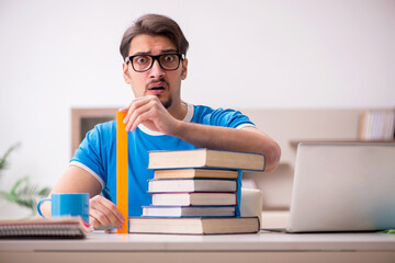 Young male student studying at home