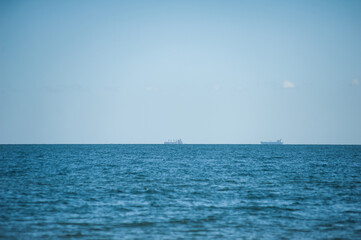 Obraz premium Beautiful sea day landscape. Light waves on the coast