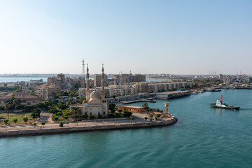 An Egyptian Mosque and maritime port at the city of Tawfiq (Suburb of Suez), on the southern end of the Suez Canal before exiting into the Red Sea. 